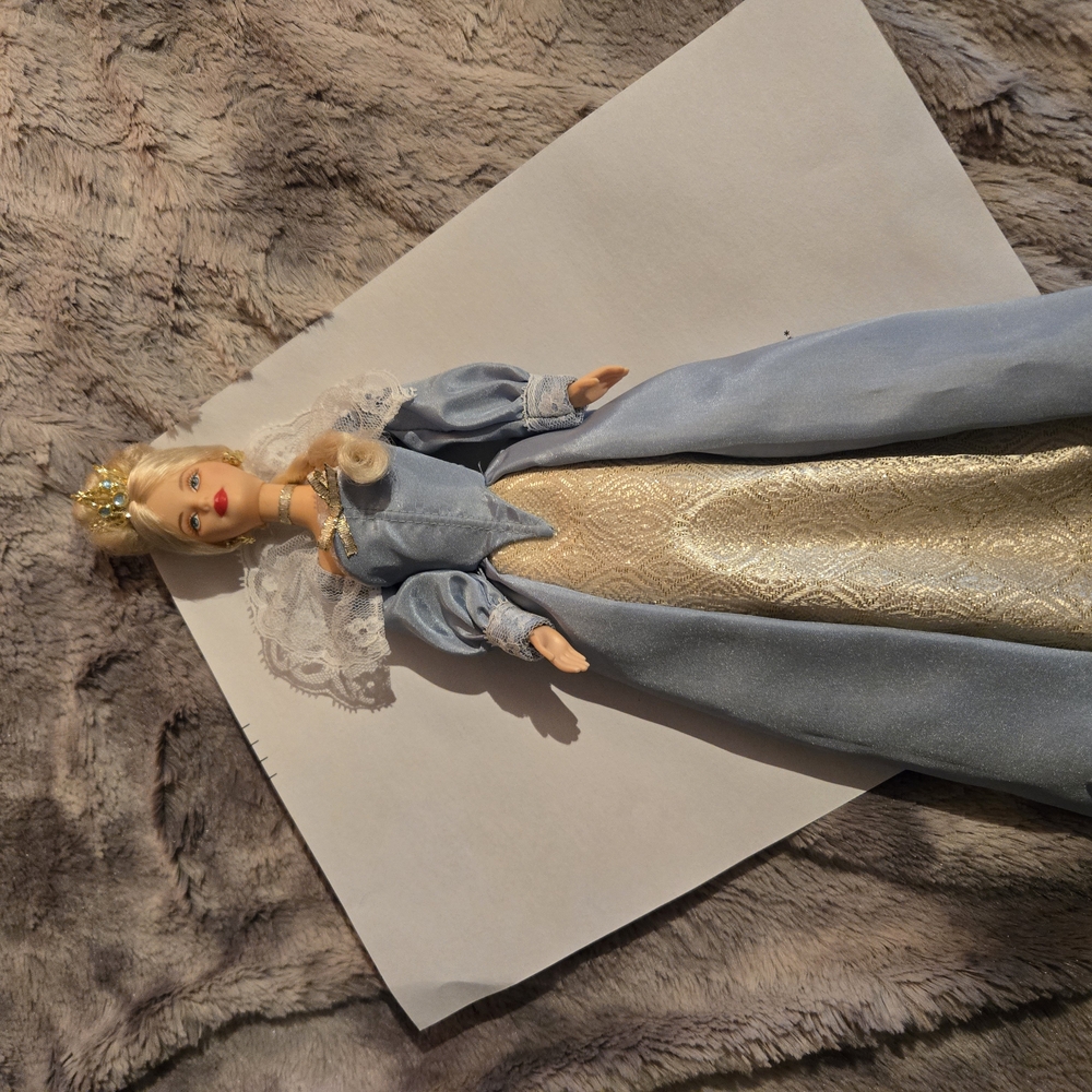 Elegant Blue and Gold Doll with Crown